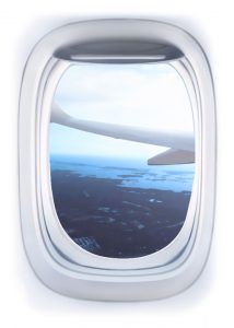 Airplane Window view showing wing and landscape